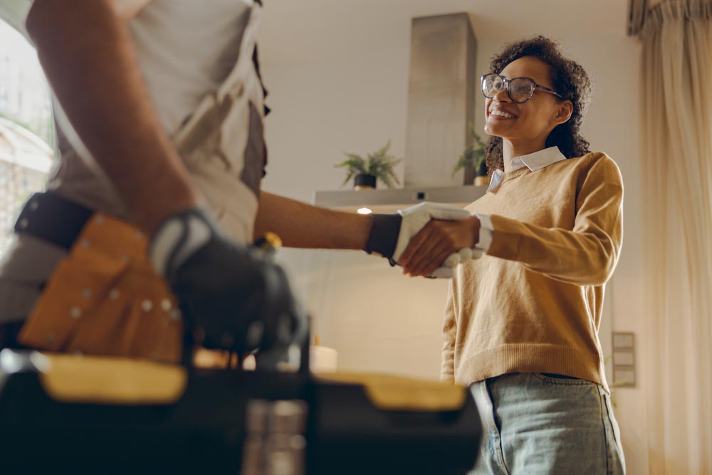 a client talking to an American Rooter technician