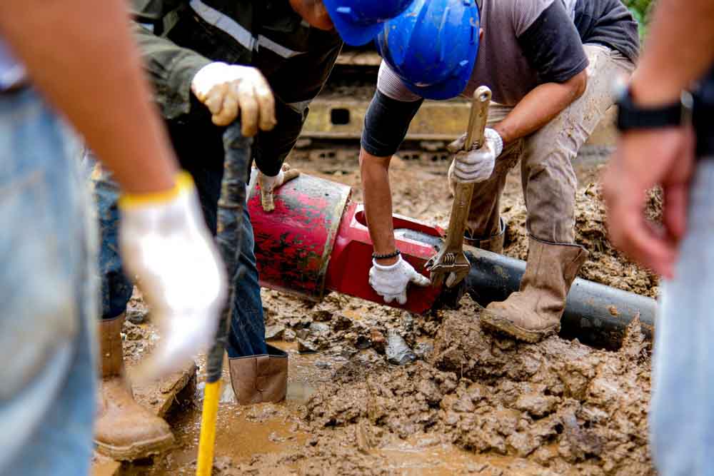 American Rooter technician working on trenchless repairs